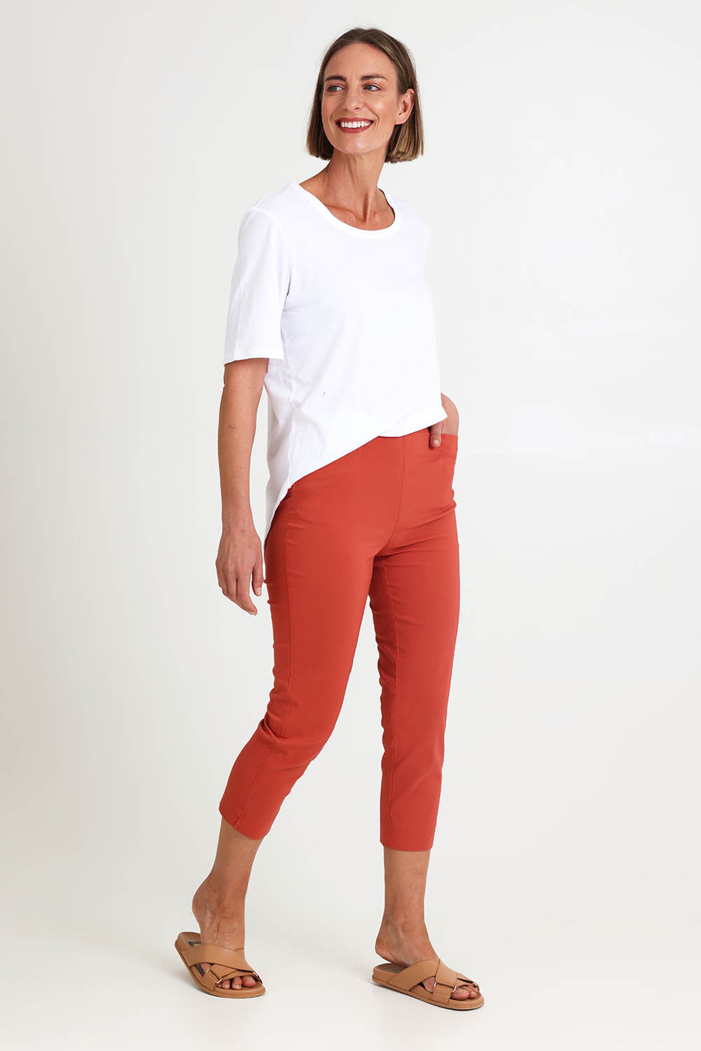 Model Riinar wearing size 10 of the Zara Pant - Ginger in colour Ginger, from the front