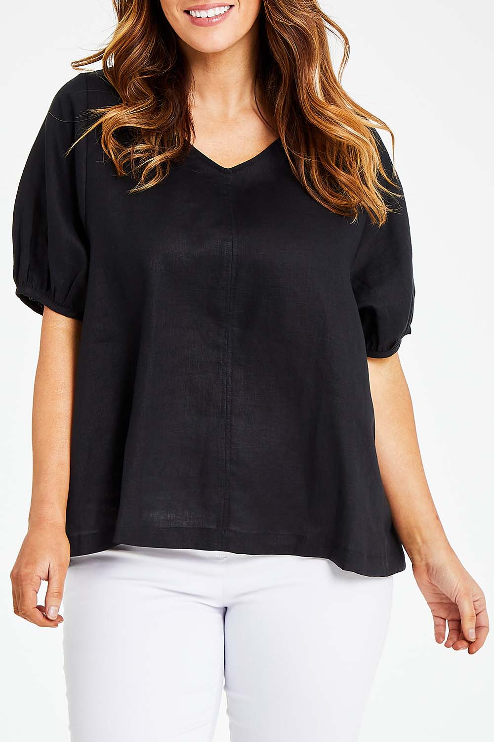 Model Laura wearing size L of the Bishop Sleeve Tee in colour Black (Black), from the front, cropped image