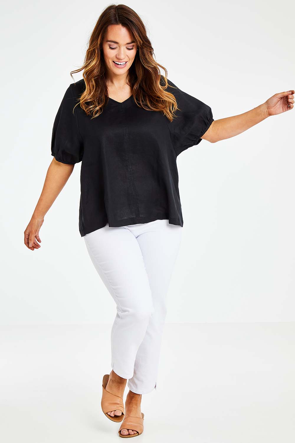 Model Laura wearing size L of the Bishop Sleeve Tee in colour Black (Black), from the front, showing the whole outfit