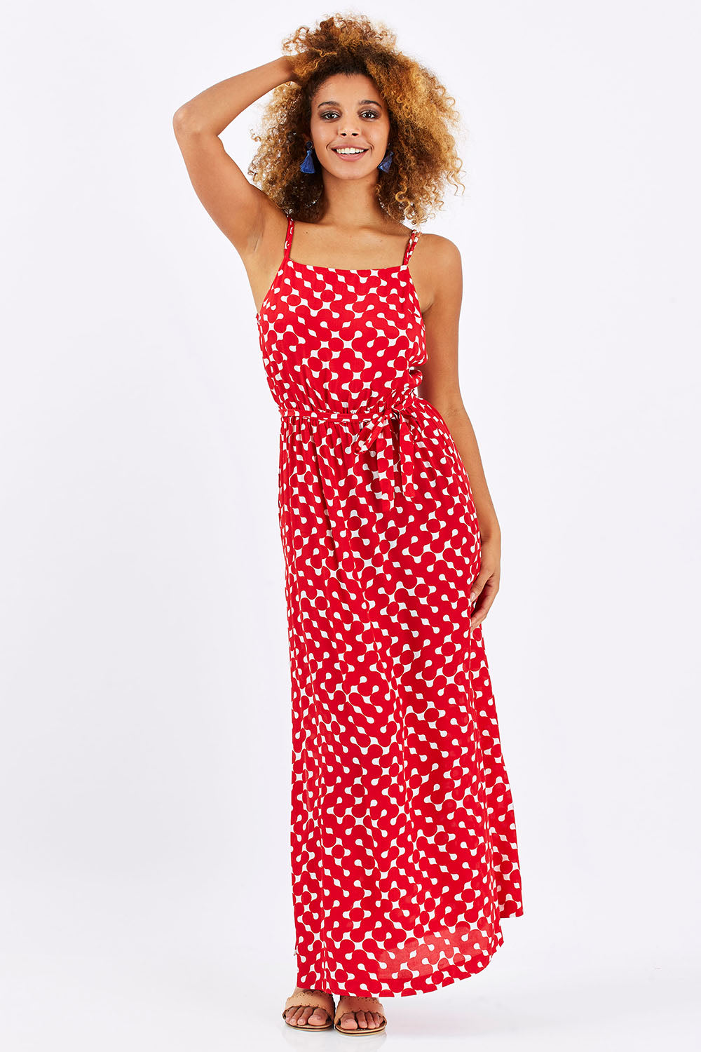 Model Summer wearing size 1 of the Zuzka Dress in colour Soundgarde (Red), from the front, showing the whole outfit