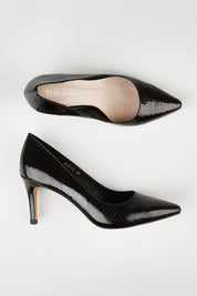 A model wearing size 36 of the Barrios Leather Heel in colour Blackmirro (Black), from the front, showing the whole outfit