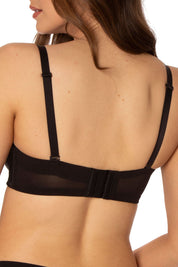 A model wearing the Beautiful Silhouette Bra in colour Black (Black), from the back