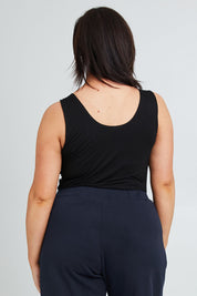 Model Poppy wearing the Modal Shelf Bra Tank in colour Black (Black), from the back