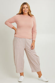 Model Fiona wearing the Wool Saddle Shoulder Sweater in colour Blushpink (Pink), from the front, showing the whole outfit