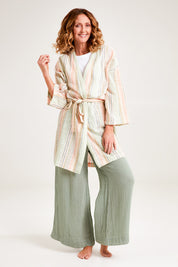 Model Emma wearing the Cotton Stripe Dressing Robe in colour Softstripe (Green), from the front, showing the whole outfit