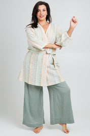 Model Poppy wearing the Cotton Stripe Dressing Robe in colour Softstripe (Green), from the front, showing the whole outfit