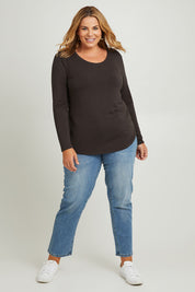Model Fiona wearing the Classic Fit Long Sleeve Modal Tee in colour Deepgreen (Green), from the front, showing the whole outfit