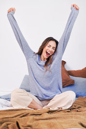 Model Amanda wearing the Raglan Sleeve Pullover in colour Indigo (Blue), from the front, cropped image