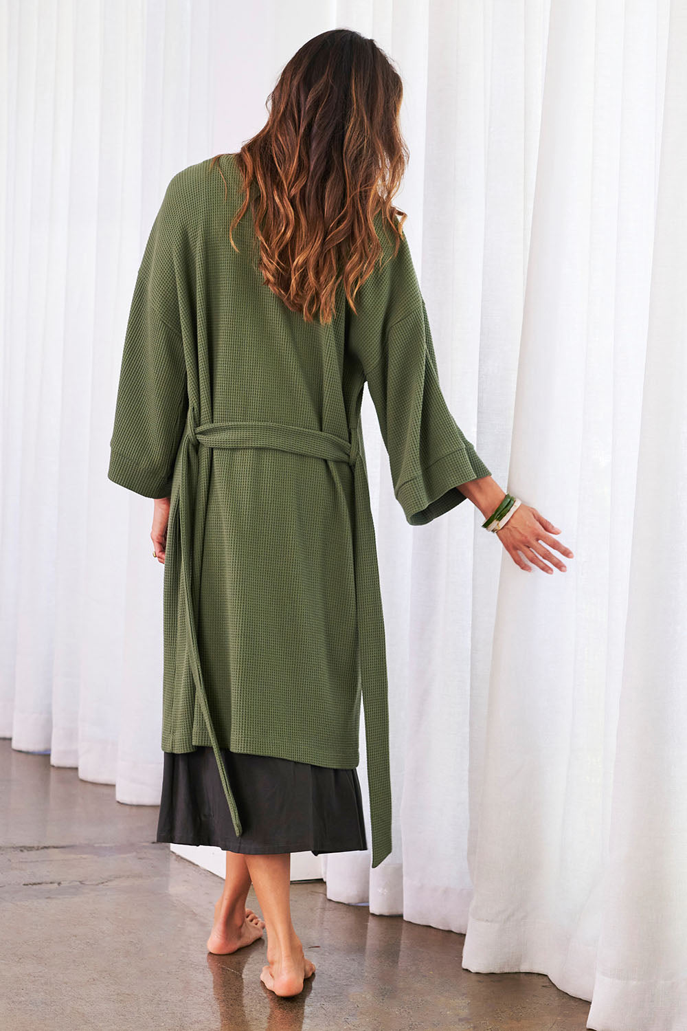 Model Amanda wearing the Cotton Waffle Dressing Robe in colour Norigreen (Green), from the back