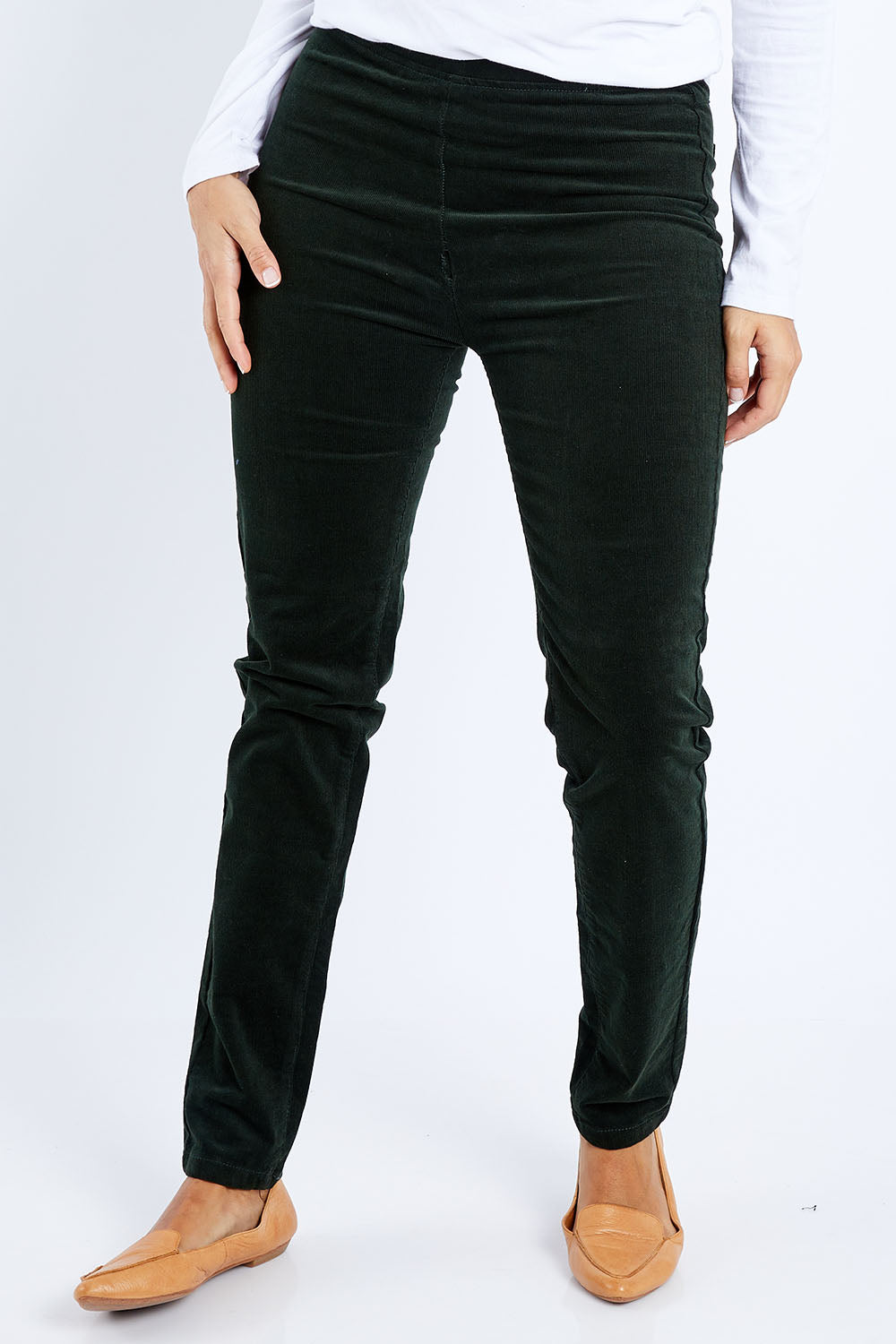 Model Lala wearing size 10 of the Skinny Leg Cord Pull On Pant in colour Forest (Green), from the front, cropped image