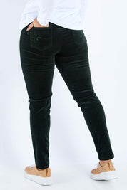 Model Sasha-Lee wearing size 16 of the Skinny Leg Cord Pull On Pant in colour Forest (Green), from the back