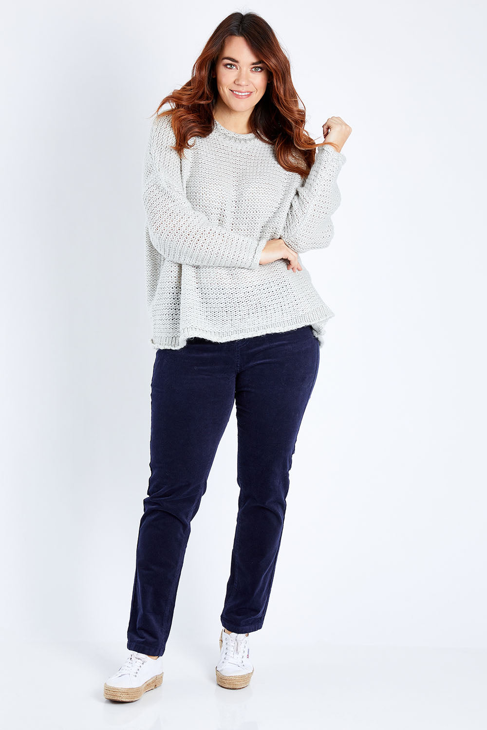 Model Laura wearing size 12 of the Skinny Leg Cord Pull On Pant in colour Navy (Blue), from the front, showing the whole outfit