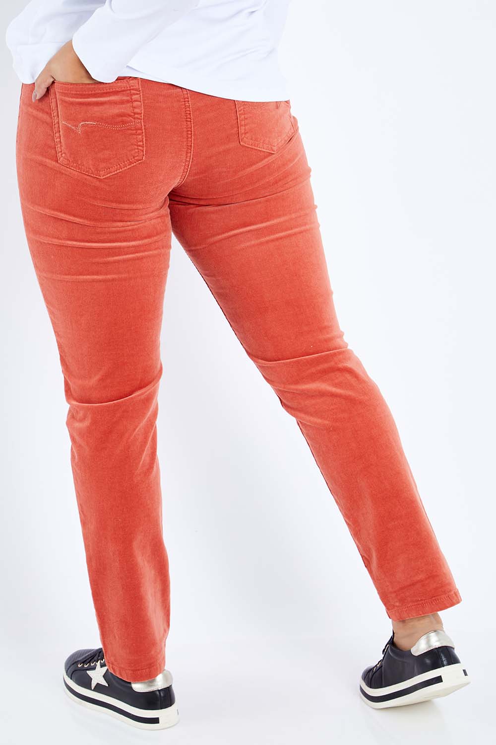 Model Sasha-Lee wearing size 16 of the Pin Cord Slim Pant in colour Auburn, from the back