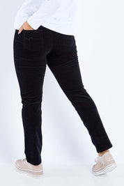 Model Sasha-Lee wearing size 16 of the Pin Cord Slim Pant in colour Black (Black), from the back