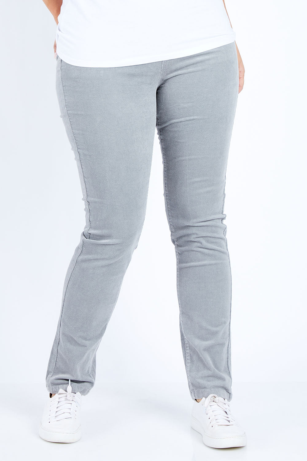 Model Jess wearing size 14 of the Pin Cord Slim Pant in colour Cloud (Blue), from the front, cropped image