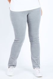 Model Jess wearing size 14 of the Pin Cord Slim Pant in colour Cloud (Blue), from the front, cropped image