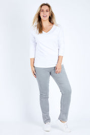 Model Jess wearing size 14 of the Pin Cord Slim Pant in colour Cloud (Blue), from the front, showing the whole outfit
