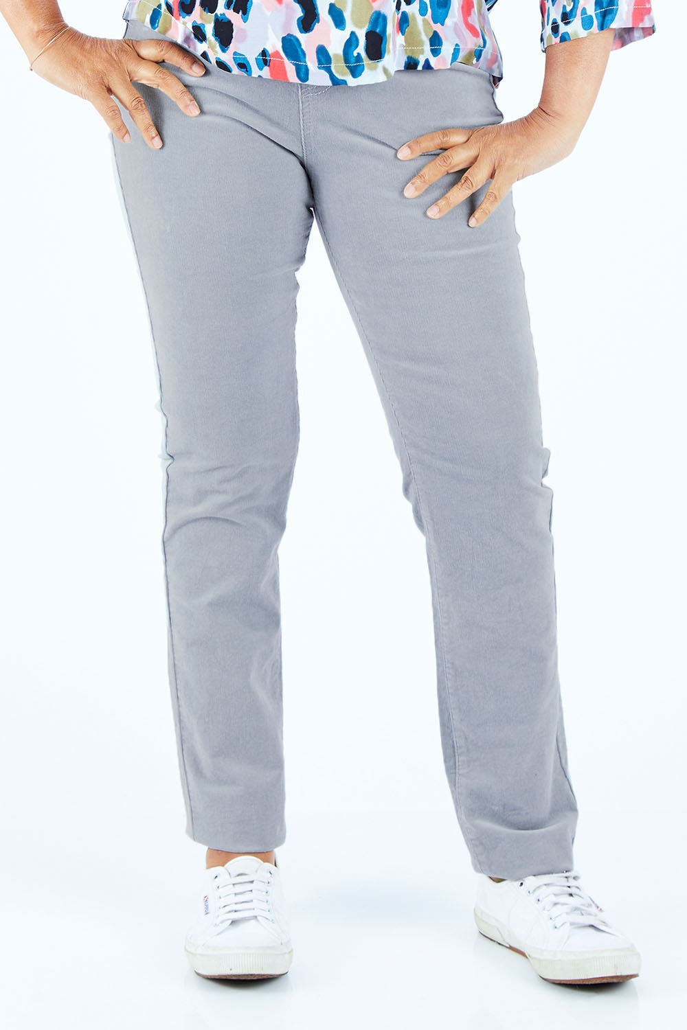 Model Nadine wearing size 10 of the Pin Cord Slim Pant in colour Cloud (Blue), from the front, cropped image