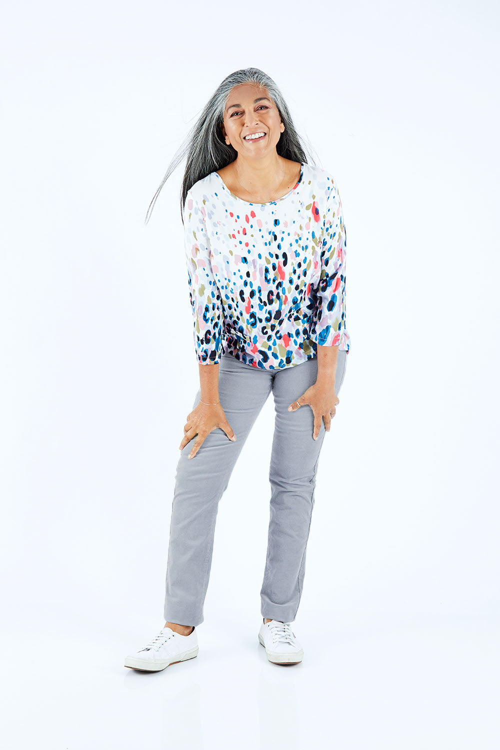 Model Nadine wearing size 10 of the Pin Cord Slim Pant in colour Cloud (Blue), from the front, showing the whole outfit