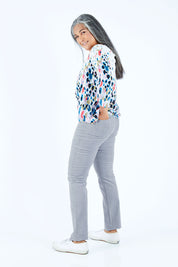 Model Nadine wearing the Pin Cord Slim Pant in colour Cloud (Blue), from the back