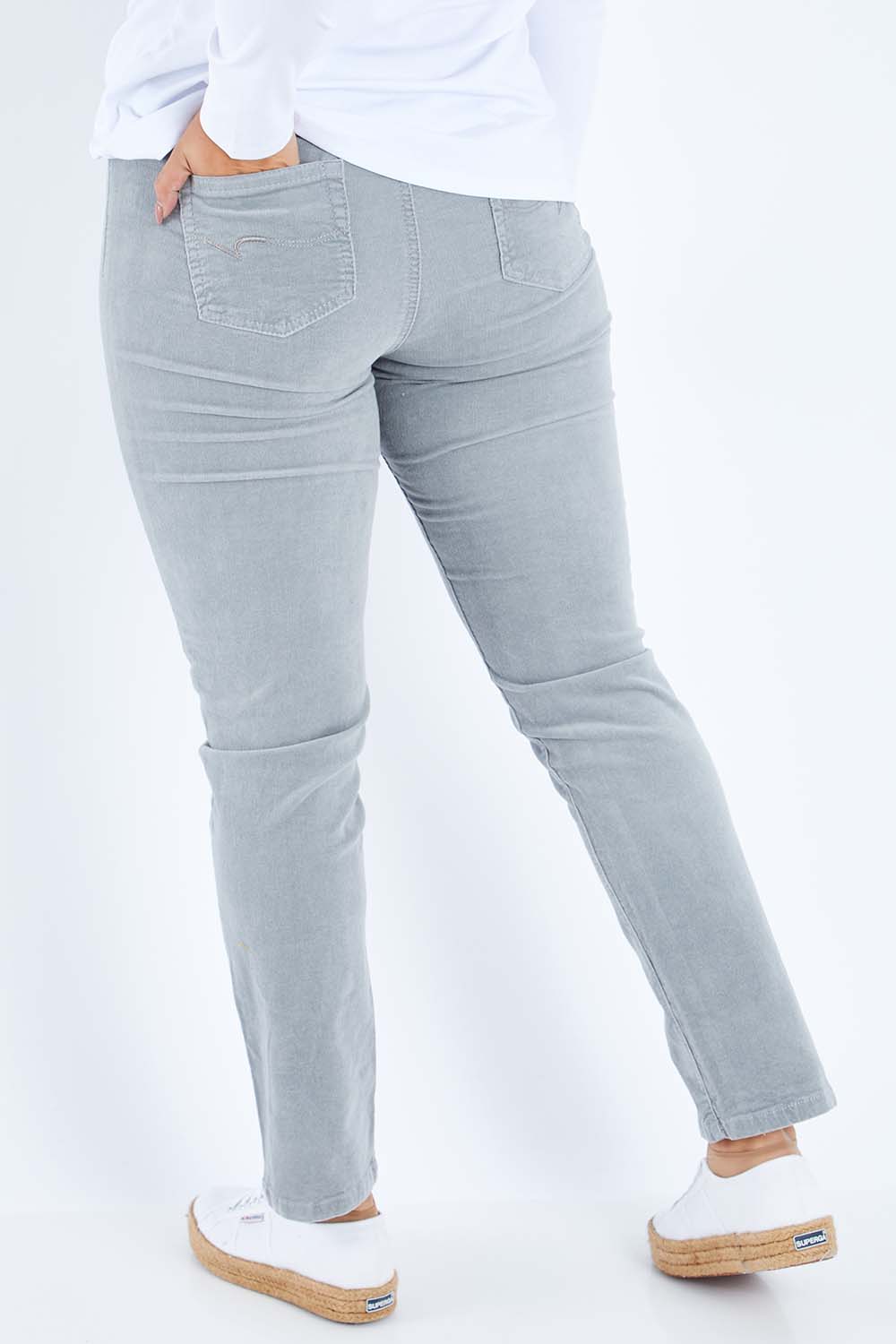 Model Sasha-Lee wearing size 16 of the Pin Cord Slim Pant in colour Cloud (Blue), from the back