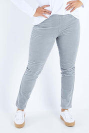 Model Sasha-Lee wearing size 16 of the Pin Cord Slim Pant in colour Cloud (Blue), from the front, cropped image
