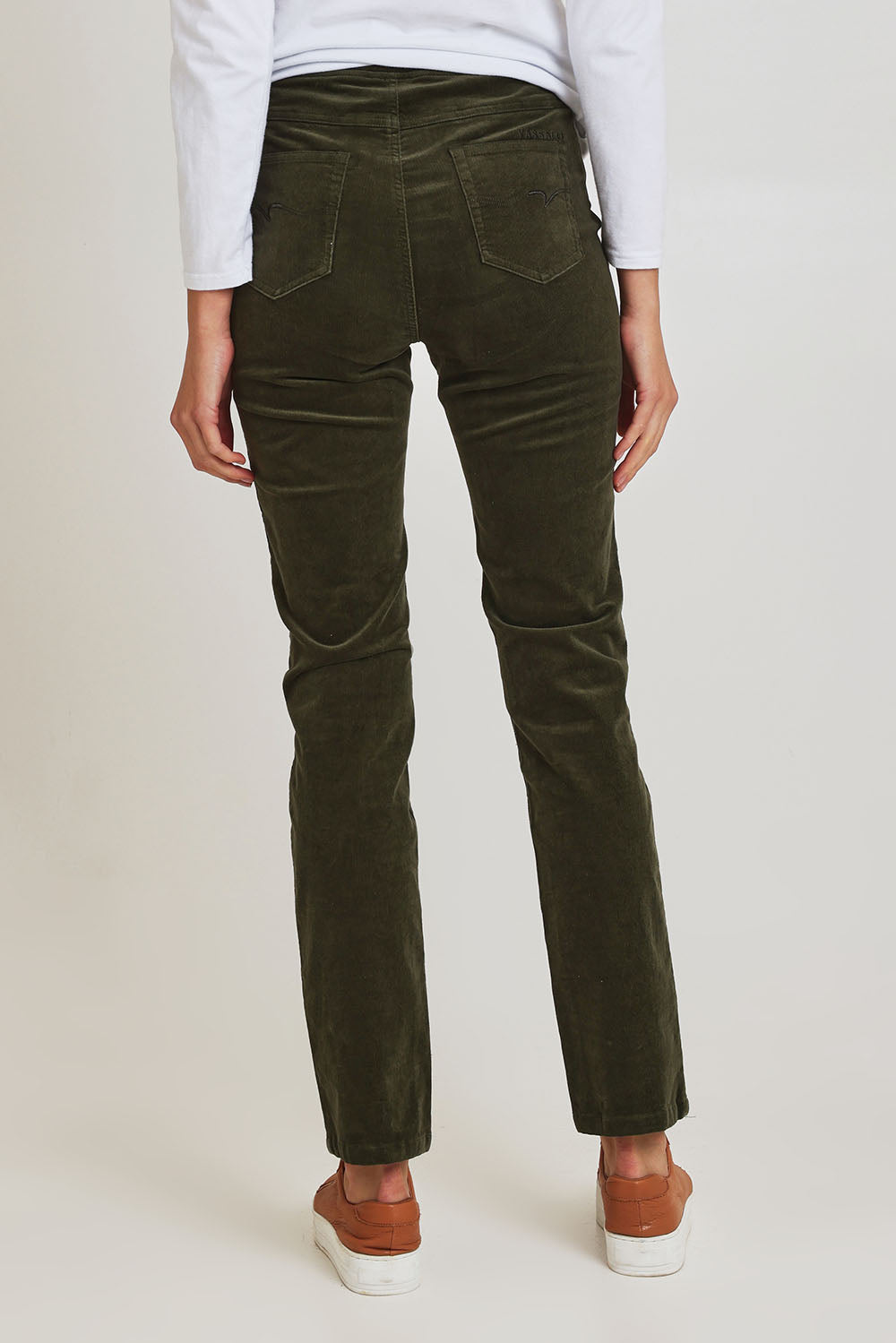 Model Madeline wearing size 10 of the Pin Cord Slim Pant in colour Deepsage (Green), from the back