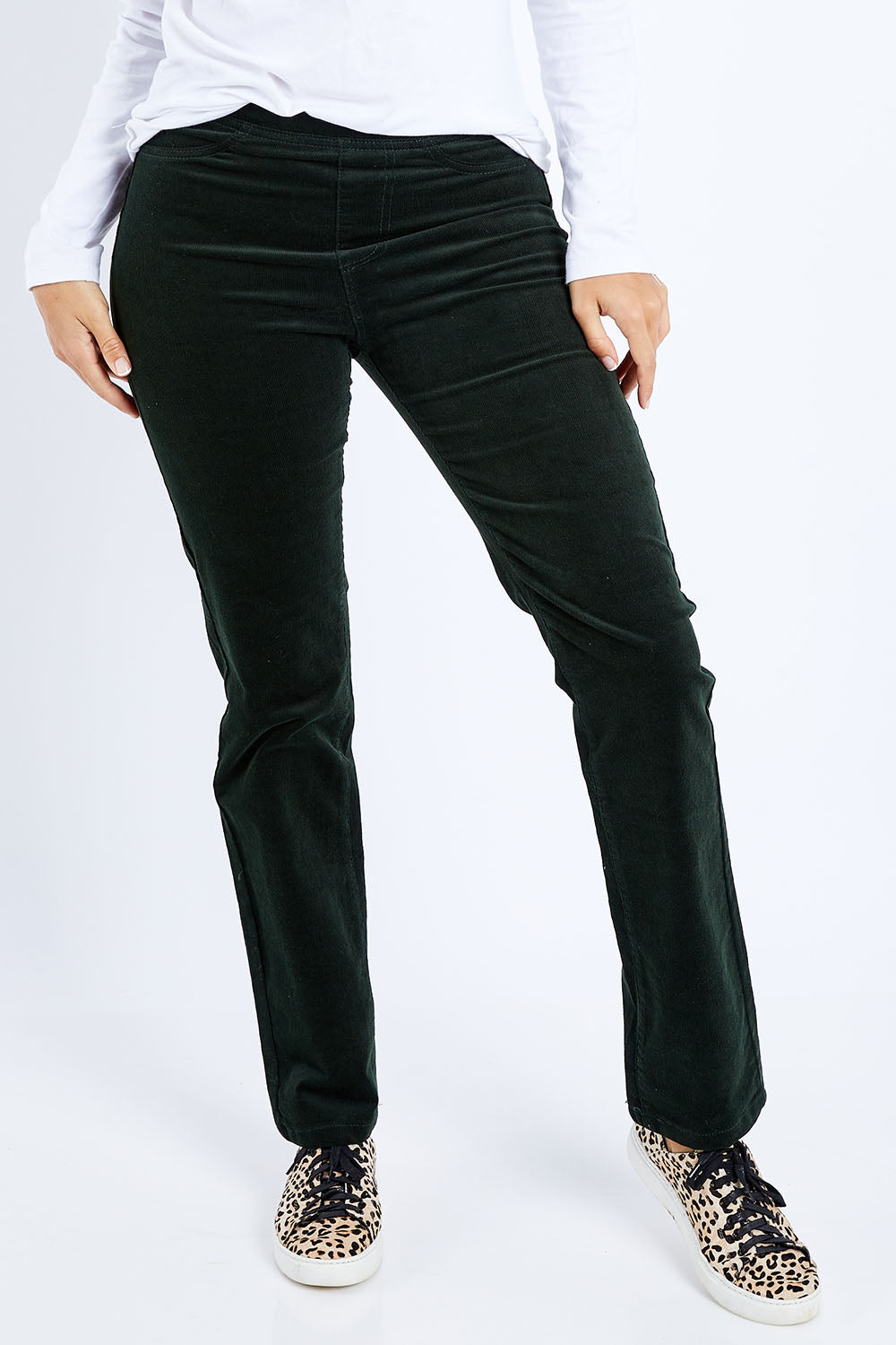 Model Lala wearing size 10 of the Pin Cord Slim Pant in colour Forest (Green), from the front, cropped image
