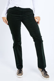 Model Lala wearing size 10 of the Pin Cord Slim Pant in colour Forest (Green), from the front, cropped image