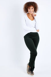 Model Lala wearing size 10 of the Pin Cord Slim Pant in colour Forest (Green), from the front, showing the whole outfit