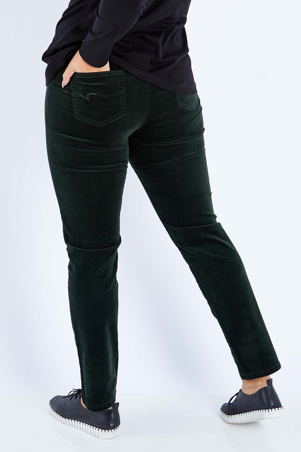 Model Sasha-Lee wearing size 16 of the Pin Cord Slim Pant in colour Forest (Green), from the back