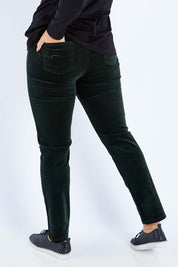Model Sasha-Lee wearing size 16 of the Pin Cord Slim Pant in colour Forest (Green), from the back