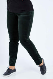 Model Sasha-Lee wearing size 16 of the Pin Cord Slim Pant in colour Forest (Green), from the front, cropped image