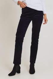 Model Madeline wearing size 10 of the Pin Cord Slim Pant in colour Midnight (Blue), from the front, cropped image