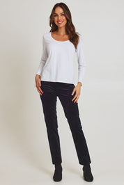 Model Madeline wearing size 10 of the Pin Cord Slim Pant in colour Midnight (Blue), from the front, showing the whole outfit