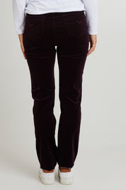 Model Katie wearing size 10 of the Pin Cord Slim Pant in colour Mulberry (Purple), from the back