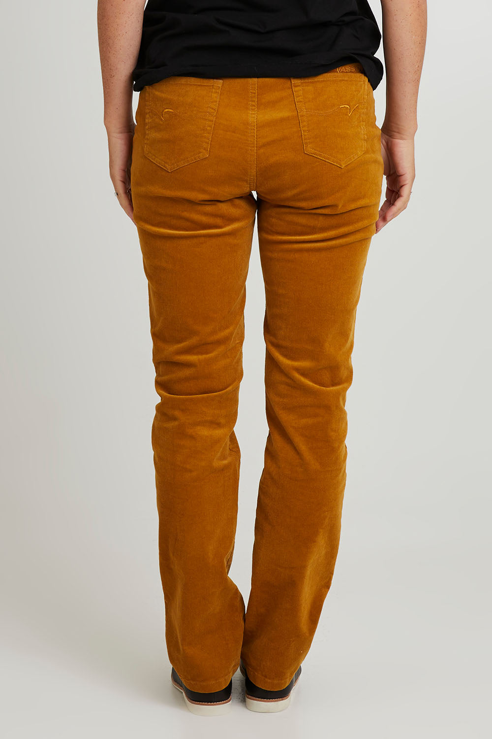 Model Katie wearing size 10 of the Pin Cord Slim Pant in colour Mustard, from the back