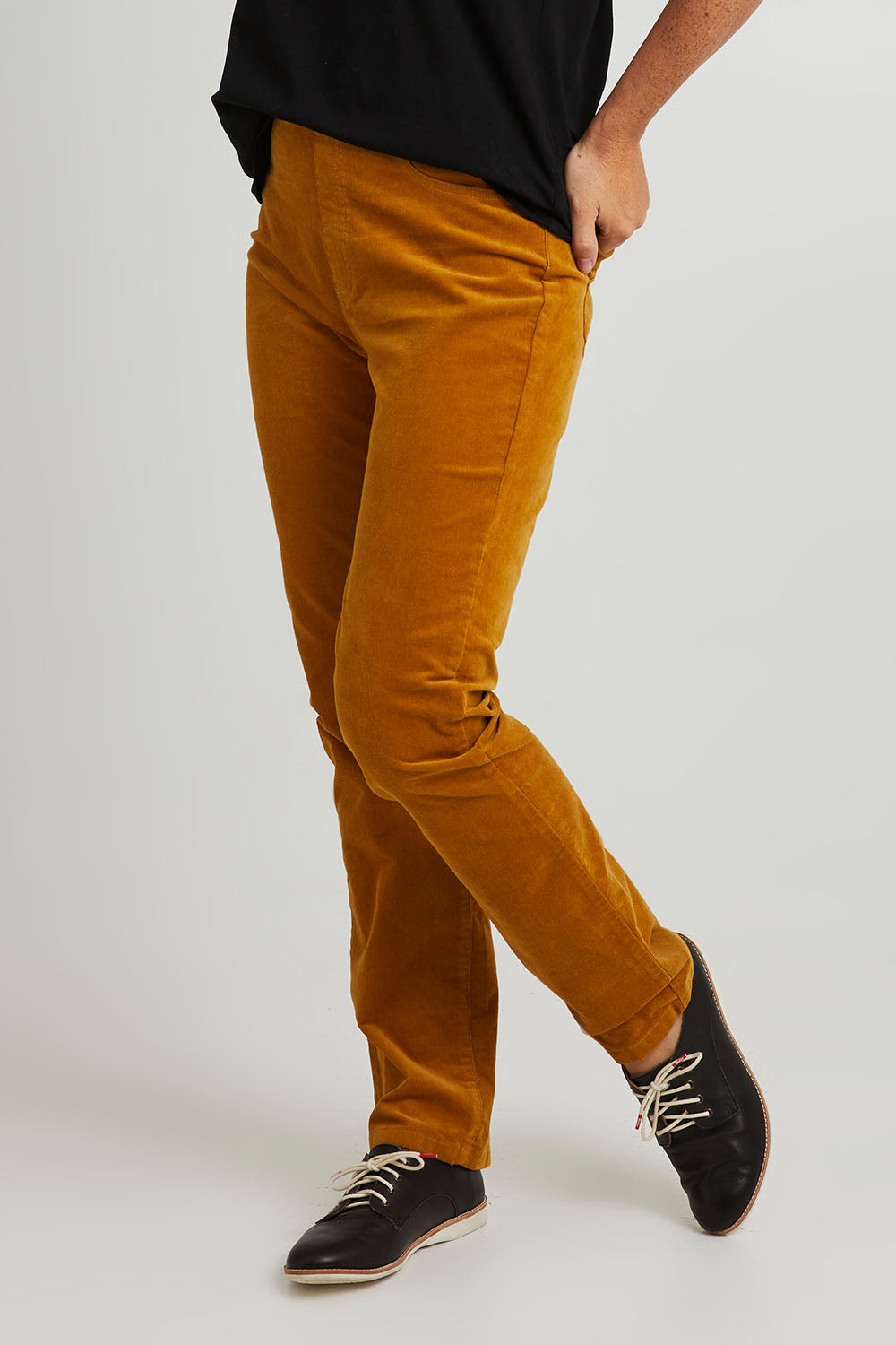 Model Katie wearing size 10 of the Pin Cord Slim Pant in colour Mustard, from the front, cropped image
