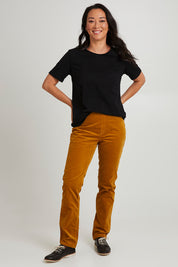 Model Katie wearing size 10 of the Pin Cord Slim Pant in colour Mustard, from the front, showing the whole outfit