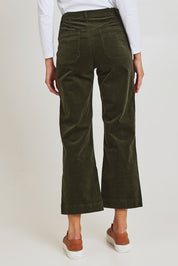 Model Madeline wearing size 10 of the Wide Leg Ankle Grazer Pant in colour Deepsage (Green), from the back