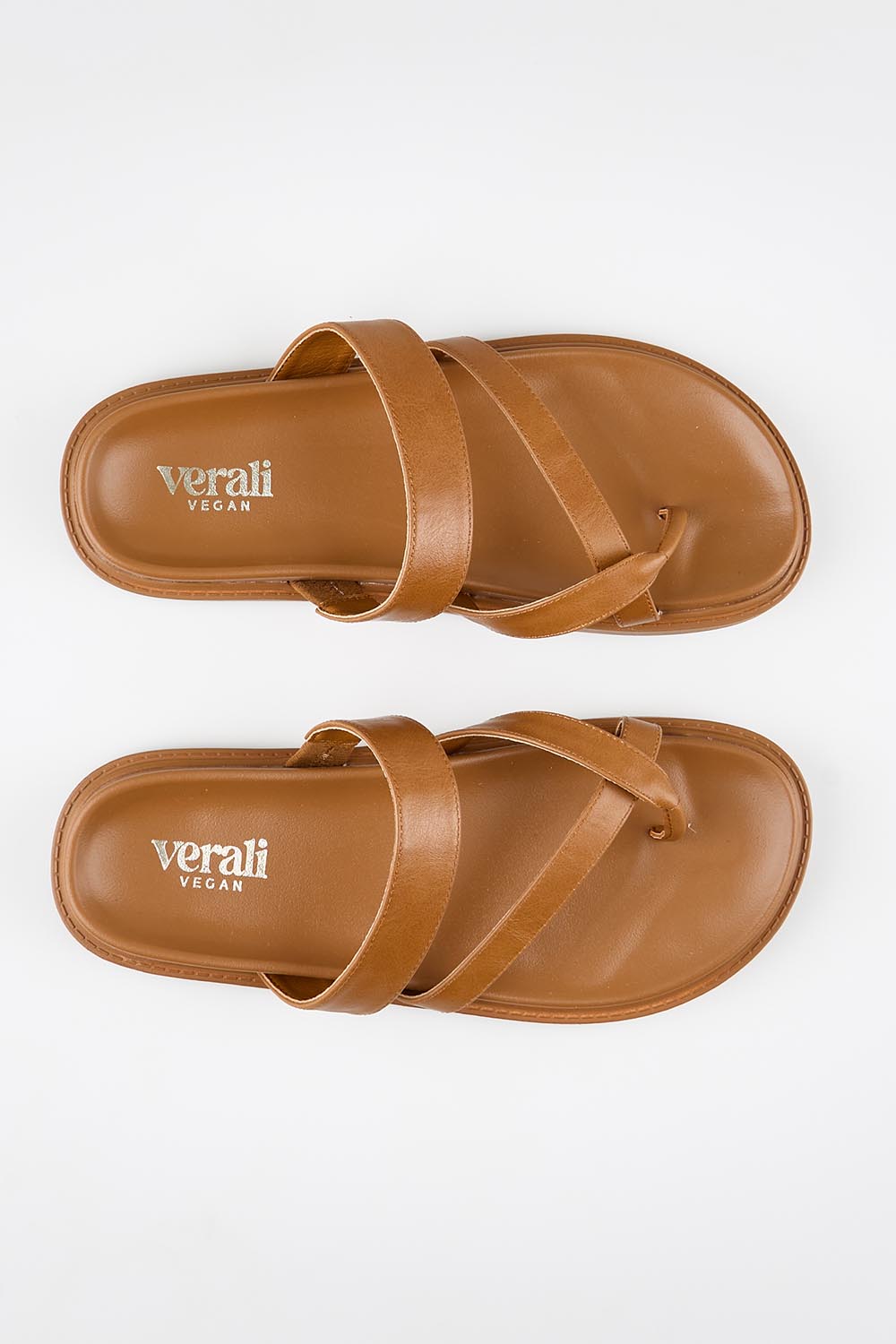 Model Genericm wearing size sample of the Binky Slide - Tan in colour Tan, in a cropped view