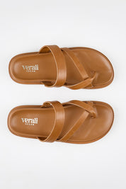 Model Genericm wearing size sample of the Binky Slide - Tan in colour Tan, in a cropped view