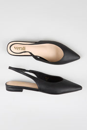 Model Genericm wearing size sample of the Hillary Slingback Flat - Black in colour Black, in a cropped view