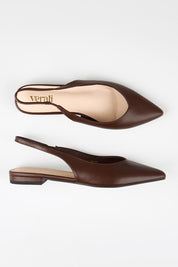 Model Genericm wearing size sample of the Hillary Slingback Flat - Chocolate in colour Chocolate, in a cropped view
