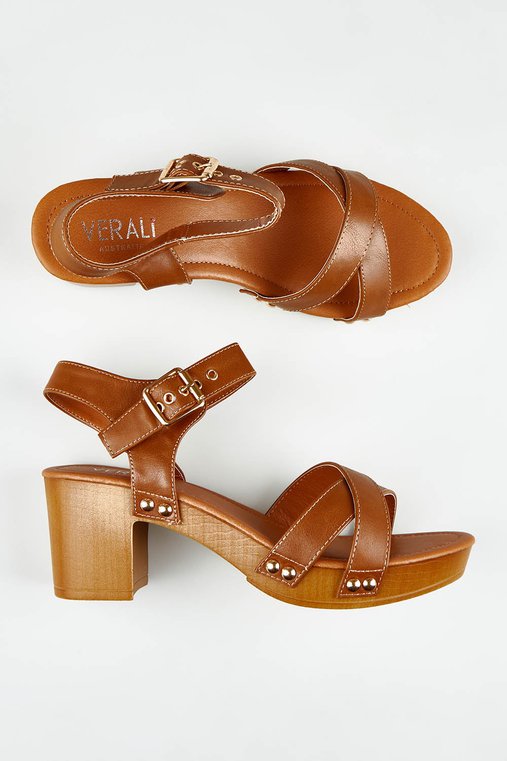 A model wearing size 37 of the Lulu Clog Heel in colour Tan, from the front, showing the whole outfit