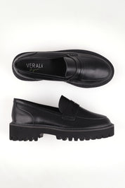 A model wearing size 37 of the Neon Loafer in colour Black (Black), from the front, showing the whole outfit