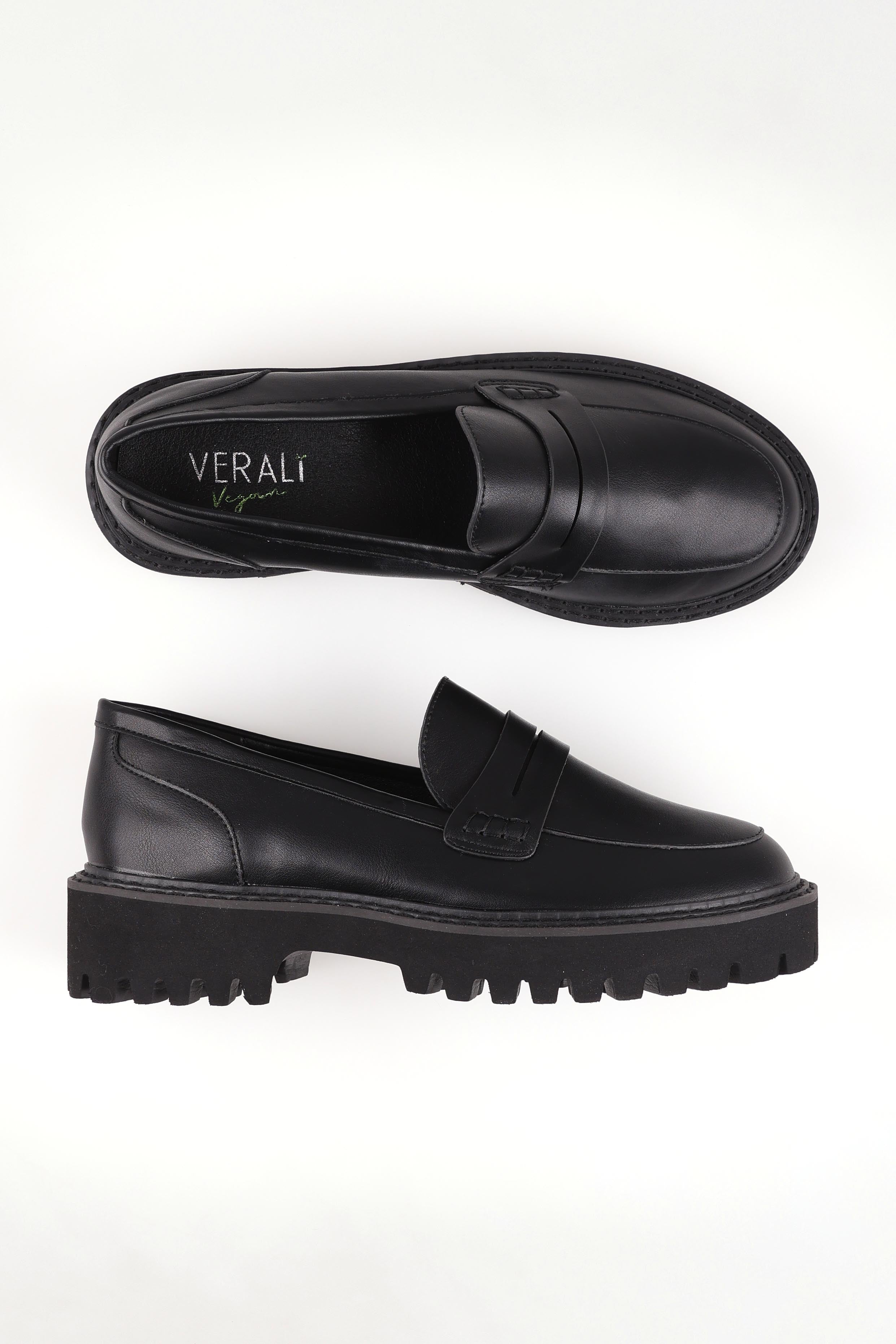 A model wearing size 37 of the Neon Loafer in colour Black (Black), from the front, showing the whole outfit