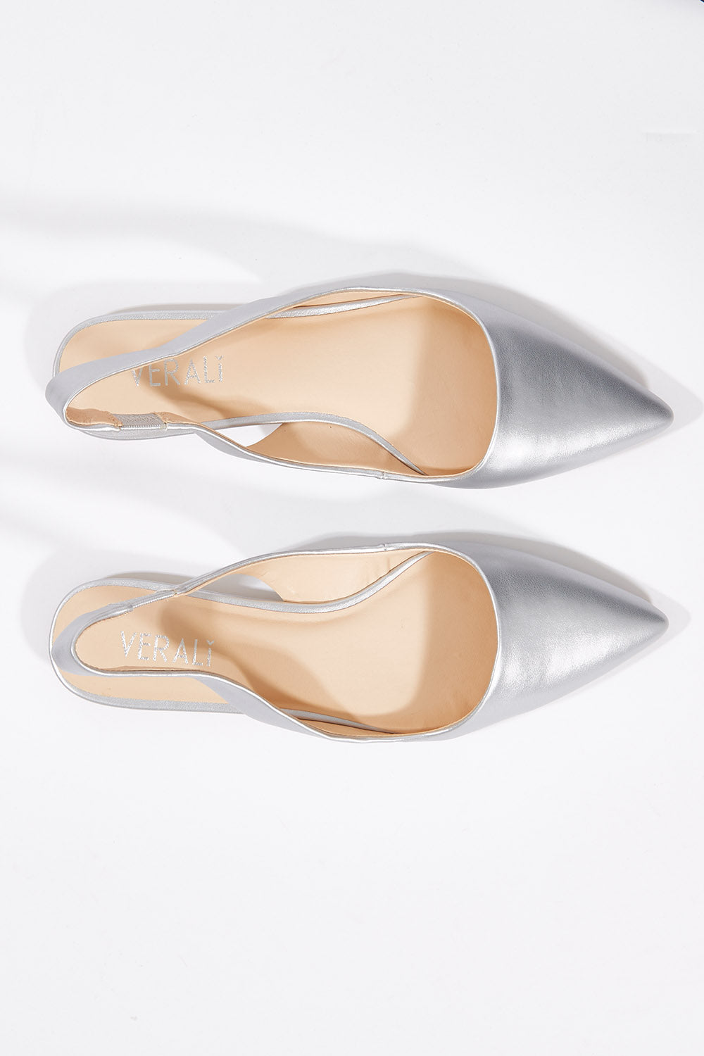 A model wearing size 37 of the Pippa Flat in colour Silver (Metallics), from the front, showing the whole outfit