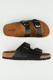 A model wearing size 37 of the Xylo Slide in colour Black (Black), from the front, showing the whole outfit