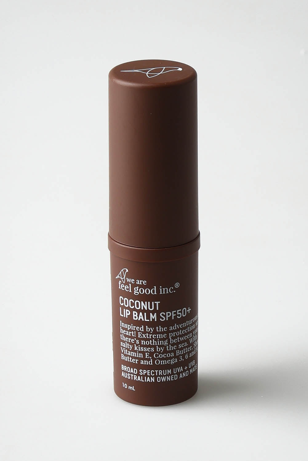 A model wearing the Coconut Lip Balm Spf50+ in colour Coconut, from the front, showing the whole outfit